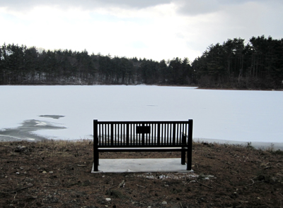 View over the frozen reservoir from behind the bench