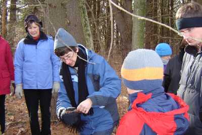 Ann Marie Pilch shows evidence of red squirrels, Jan 2007